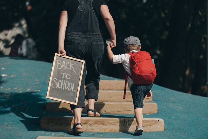 parent walking child back to school